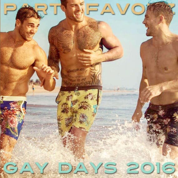 Three shirtless men in floral swimtrunks playing at the beach